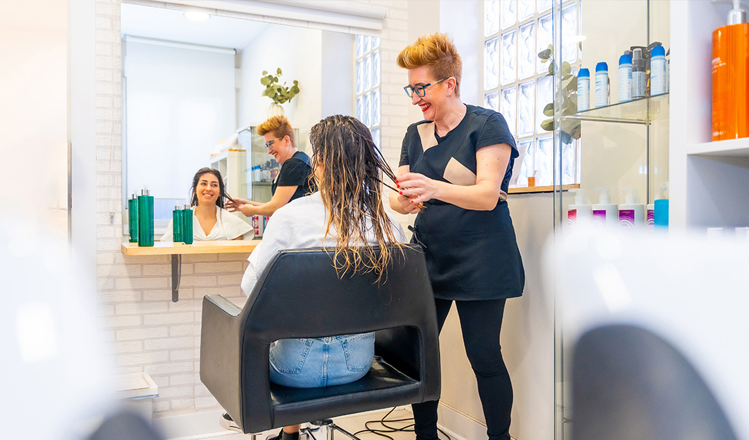 Hairdresser working with a client